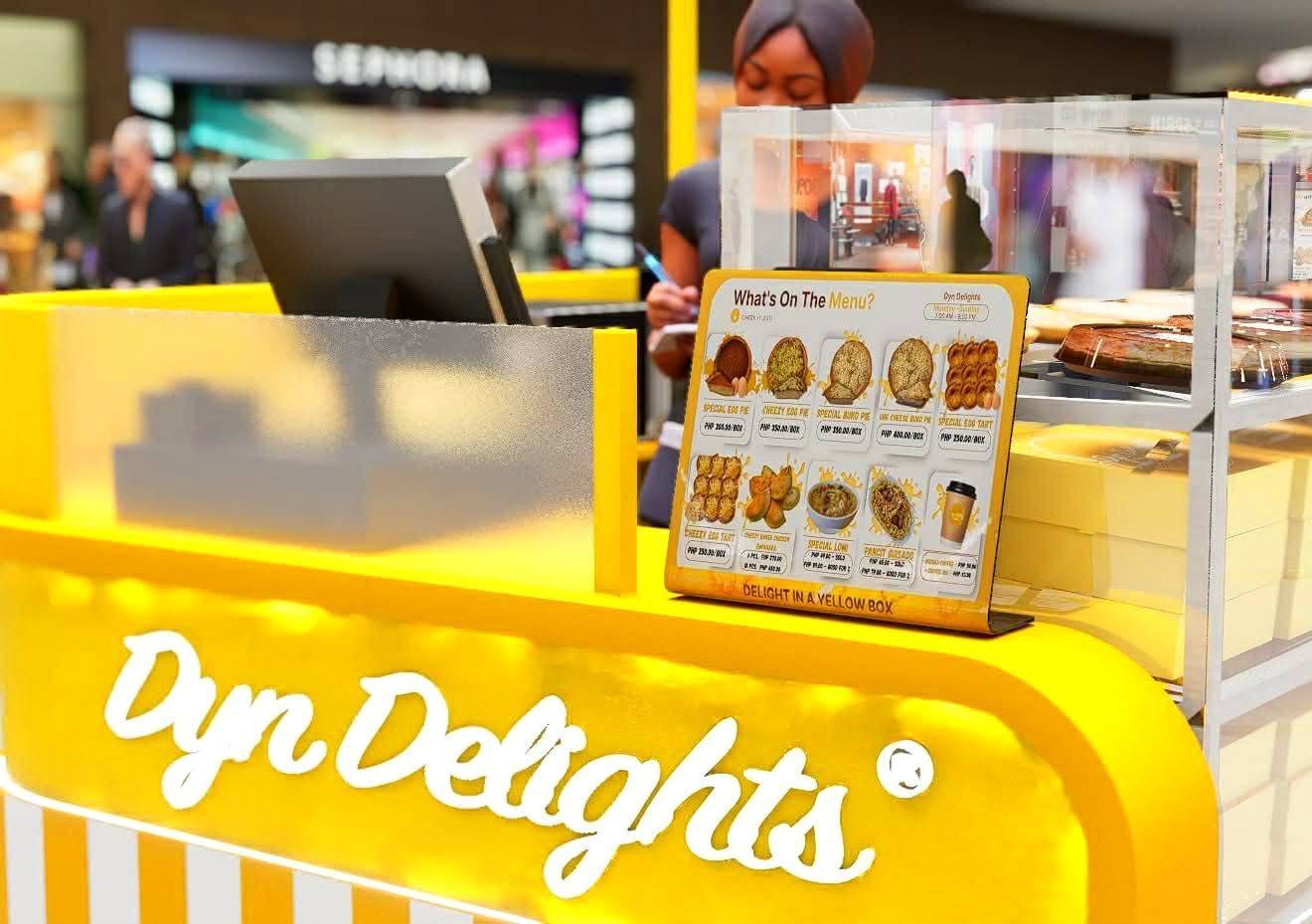 Close-up of Dyn Delights kiosk menu and counter